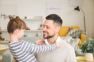 Wall Mural - Little daughter with father at home in morning