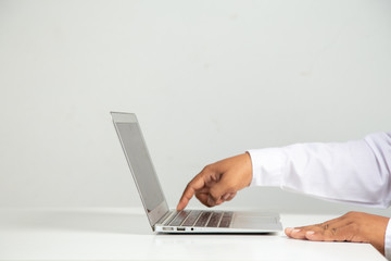 businessman hand  touching power off button  switch  laptop an office, concept: symbol Digital detox shutdown information  data electronic, close job work monitor for saving energy