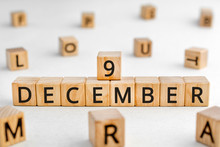 December 9 - From Wooden Blocks With Letters, Important Date Concept, White Background Random Letters Around