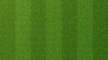 Green Grass Texture For Sport Background. Detailed Pattern Of Green Soccer Field Or Football Field Grass Lawn Texture. Green Lawn Texture Background.