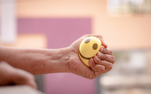Hands Squeezing Or Pressing Stress Ball At Home To Release Stress - Concept Of Stress Buster