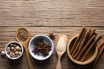 Wall Mural - Variety of spices and natural herbs supplements health food on rustic table.