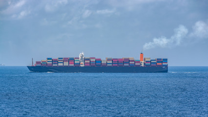 Wall Mural - Typical large boxship in design and layout have a twin-island design, with the accommodation, including the navigation bridge, located foreship and the engine room positioned semi-aft.