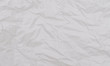 © Lifestyle Graphic - White crumpled paper texture. Abstract paper pattern for background. Close-up.