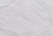 © Lifestyle Graphic - White crumpled paper texture. Abstract paper pattern for background. Close-up.