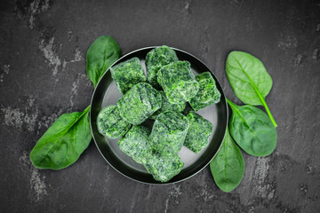 Wall Mural - Portion of frozen spinach (close up; selective focus)