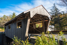 View Of A Historic Wooden Covered Bridge In The Countryside Of Vermont On A Clear Autumn Day
