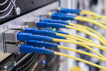concept of fast broadband access to the network. bunch of fiber-optic internet wires are connected t