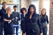 © Krakenimages.com - Group of business workers smiling happy and confident. Posing together looking at the camera, young beautiful woman with smile on face at the office