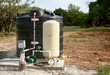 © GalinaSt - Deep water well set up, country side construction. Drilled draw well with pressure switch and storage tank.