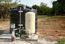 Deep Water Well Set Up, Country Side Construction. Drilled Draw Well With Pressure Switch And Storage Tank.