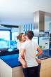 © Jordi Janau/ADDICTIVE STOCK - Side view of happy young woman sitting on kitchen counter and embracing loving husband while spending day together in modern apartment