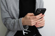 © polya_olya - hands of a teenager with a smartphone closeup