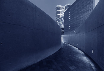Poster - Empty modern pedestrian walkway in downtown at night