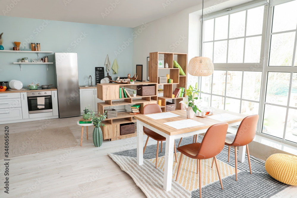 Interior of modern stylish dining room with floral decor
