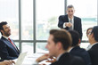 © eakgrungenerd - Group of business people sitting listen and present reviews in meeting room, leadership present, business teamwork partner concept.