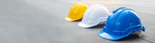 Banner Construction Hard Hat Safety Helmet Workers In Construction Site For Engineering Protection Head Standard. Many Hardhat Helmet On Row With Copy Space. Engineering Construction Concept