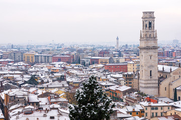 Wall Mural - Aerial view of Verona downtown in winter with snow. Verona Cathedral and church of San Zeno. UNESCO world heritage site. Veneto, Italy, Europe