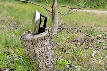 An old heavy metal iron in a hemp garden ..