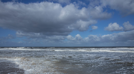  Northsea coast Netherlands. Julianadorp. Beach. Breaking waves. Clouds