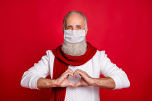Closeup Portrait Of Attractive Gray Haired Aged Man Showing Heart Shape Healthcare Medicine Concept Wear Flu Viral Mask Aisolated Bright Vivid Shine Red Background