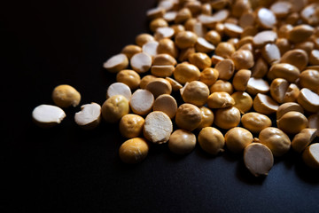 top view of Roasted gram isolated on black background