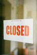 © BGStock72 - Closed sign board hanging on door of cafe or small store