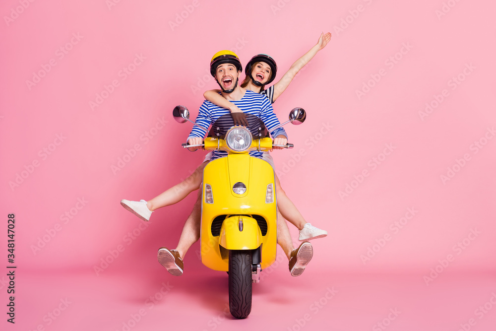 Portrait of nice attractive cheerful cheery glad carefree playful childish friends friendship driving vehicle without legs having fun fooling isolated on pink pastel color background - obrazy, fototapety, plakaty 