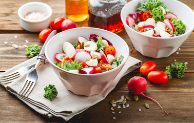 Wall Mural - Salad with cherry tomatoes, radsh and mozzarella, lettuce mix