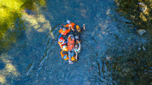 Search And Rescue Training Carrying Patient Through A River 