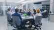 © Gorodenkoff - In the Corporate Meeting Room: Female Executive Uses Digital Interactive Whiteboard for Presentation to a Board of Directors, Lawyers, Investors. Everyone Applauds. Screen Shows Company Growth Data