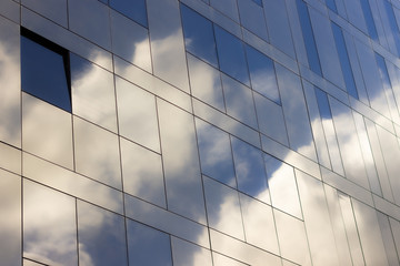 Reflections of the sky on a glassy building