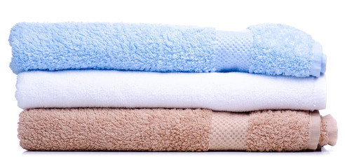 Stack of folded towels on white background isolation