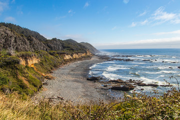 Wall Mural - A rocky beach along the natural coast of Oregon with a wall of fog offshore 
