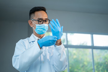 Scientist wearing glove.,Doctors are wear medical rubber gloves for protection Coronavirus Disease 2019 (COVID-19) ,Coronavirus has turned into a global emergency.