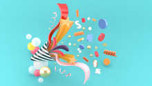 Party Popper Amidst The Like Buttons, Coins, Stars, Ribbons Among Colorful Balls On A Blue Background.-3d Rendering..