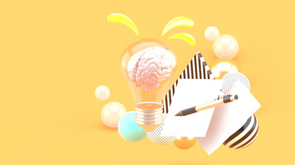 The brain in the light bulb and paper and pen among the colorful balls on the orange background.-3d rendering..