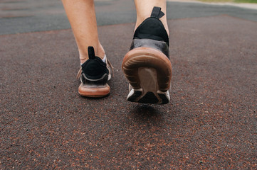 Running athlete during training outdoors in the summer on a sunny day.