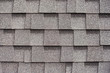 Gray shingles for covering the roof. Building material flexible tile background.