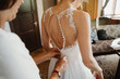 photo of a bride getting ready wearing a dress