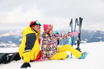 Sticker - Lovely couple with equipment at ski resort. Winter vacation