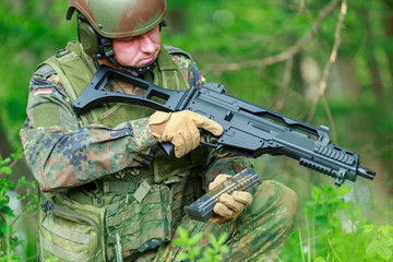 Wall Mural - German soldier with a german assault rifle