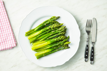 Poster - Cooked green asparagus. Healthy seasonal vegetable.