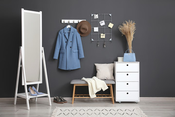 Poster - Hallway interior with stylish furniture, clothes and accessories