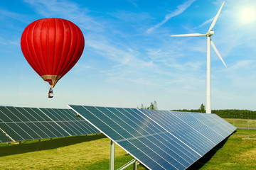 Wall Mural - hot air balloon red heart over solar panel - ecological energy dream