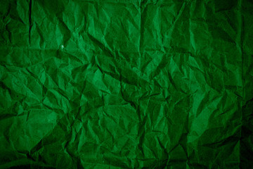 Abstract colorful background. Texture of crumpled dark green paper