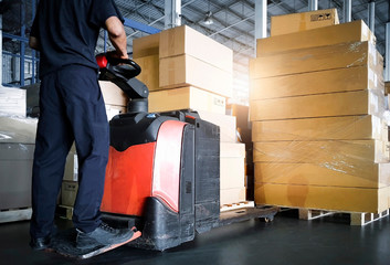 Wall Mural - Interior of storage warehouse, Worker with electric forklift pallet jack unloading pallet goods, package boxes, warehouse shipping delivery logistic and transport.