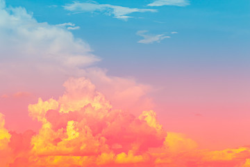 Wall Mural - Yellow and red pink color light in clouds with blue sky