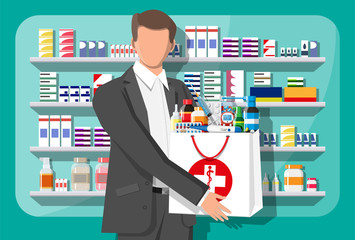 Wall Mural - Man holding drugstore bag in front of pharmacy shop. Set of bottles, tablets, pills, capsules and sprays for illness and pain treatment. Medical drug, vitamin, antibiotic. Flat vector illustration