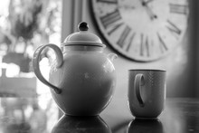 Close-up Of Teapot And Cup On Table At Home